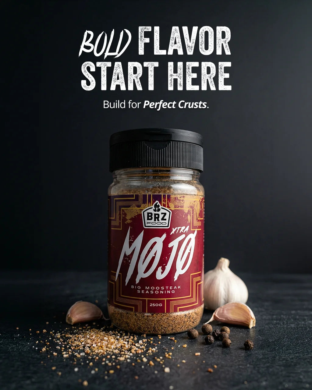 BRZ Food Xtra Mojo Steak Seasoning displayed with grilled steaks over open flames highlighting competition quality barbecue seasoning.